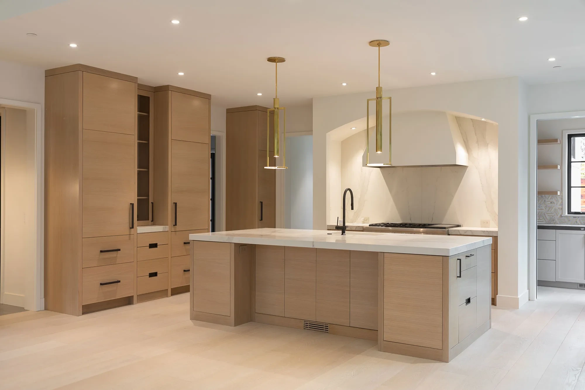 Hesketh by GHG Builders — kitchen with oak cabinetry and island