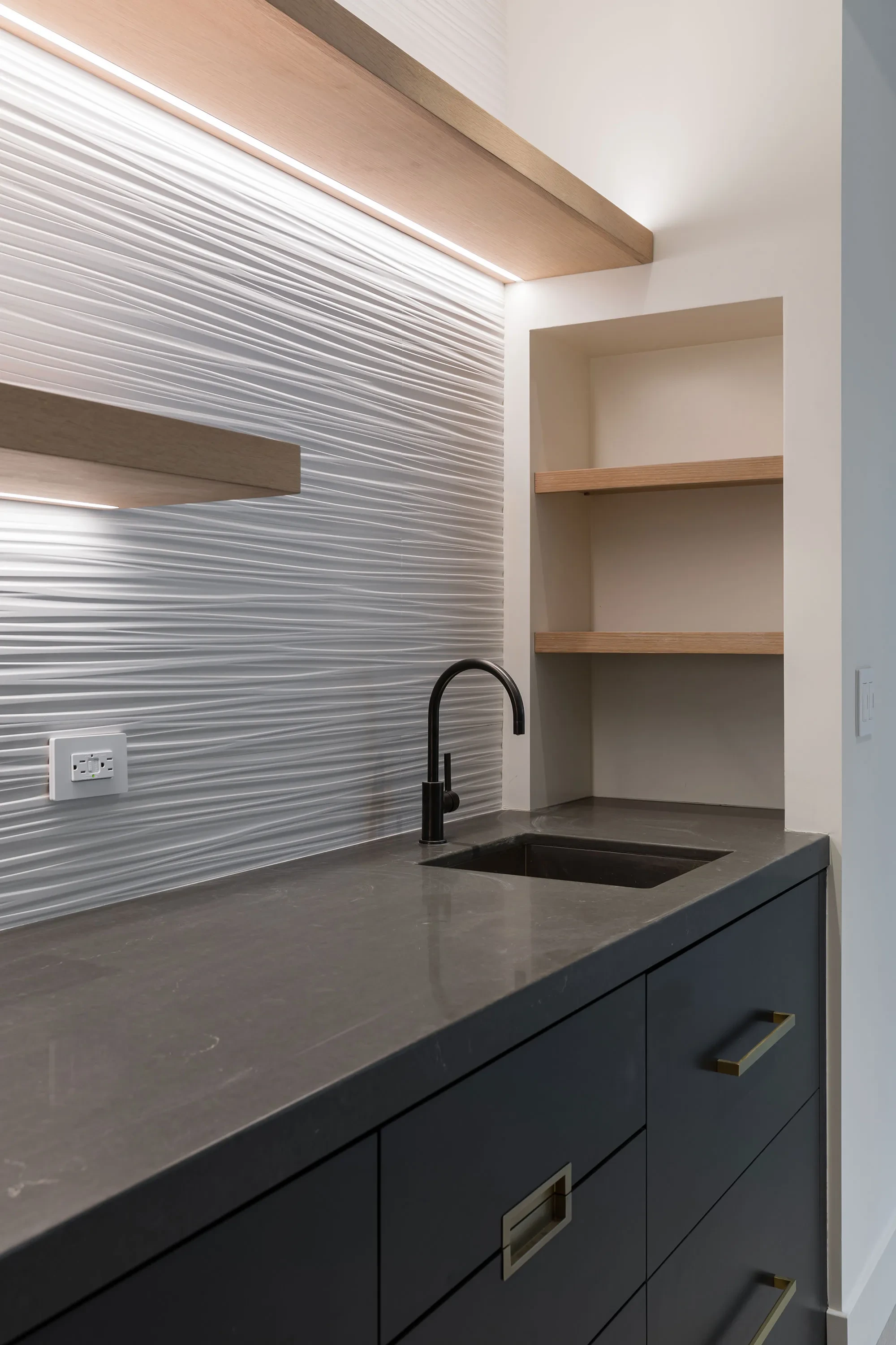 Hesketh by GHG Builders — wet bar with dark cabinetry