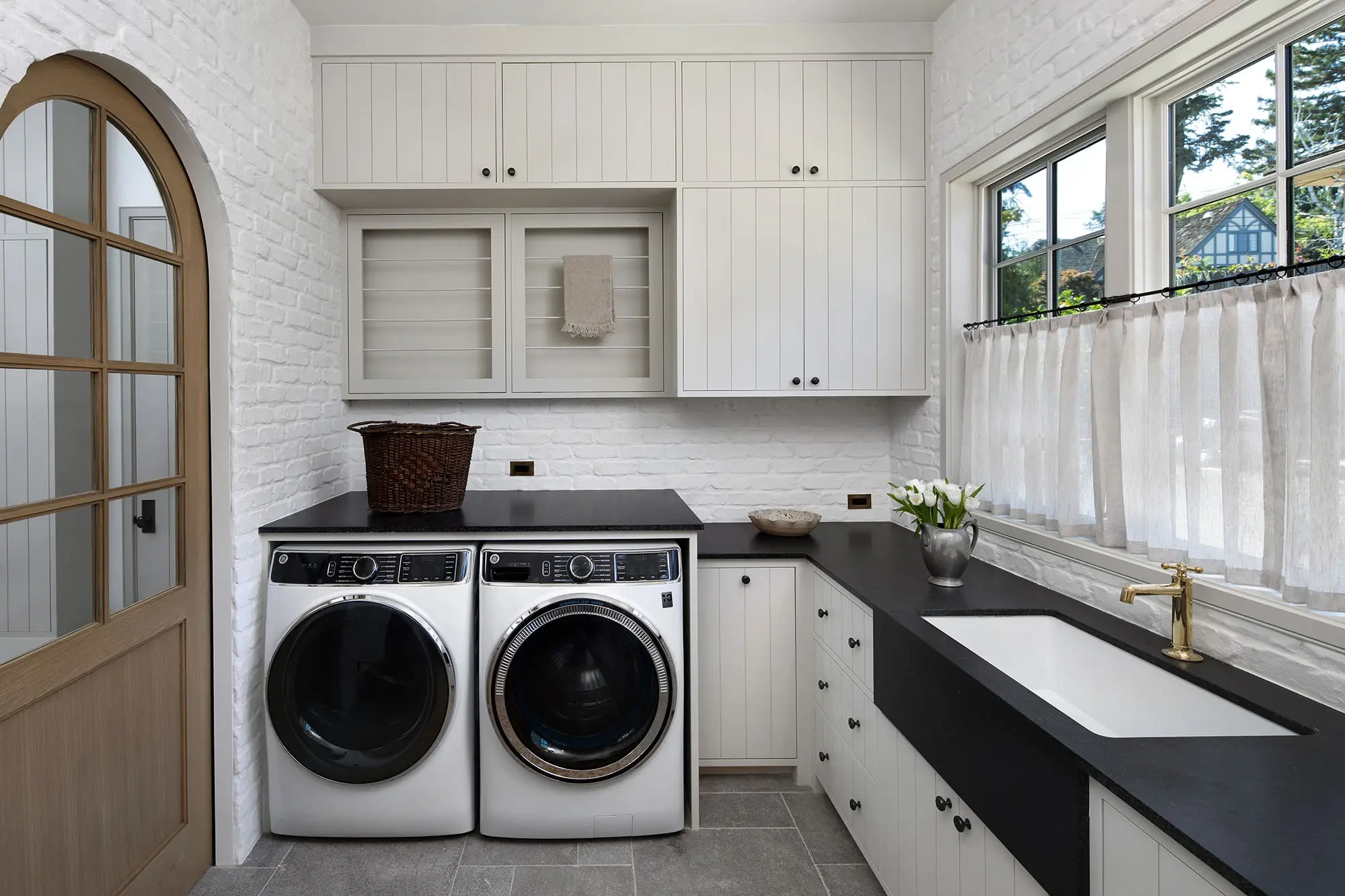 La Mesa by GHG Builders — laundry room with arched window