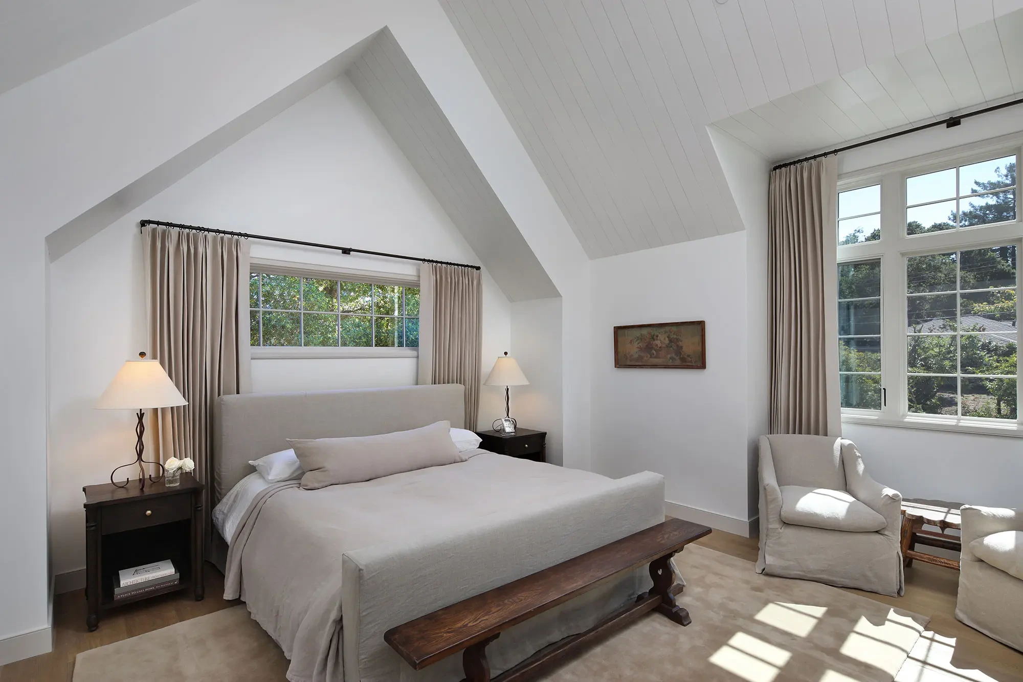 La Mesa by GHG Builders — primary bedroom under a vaulted ceiling