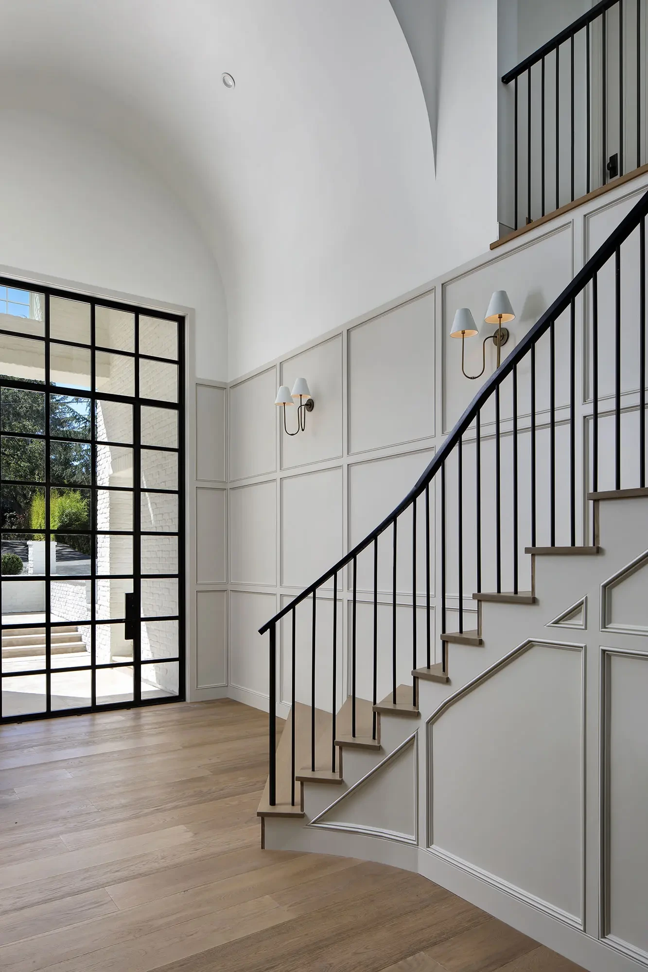 La Mesa by GHG Builders — stair hall with steel-framed window
