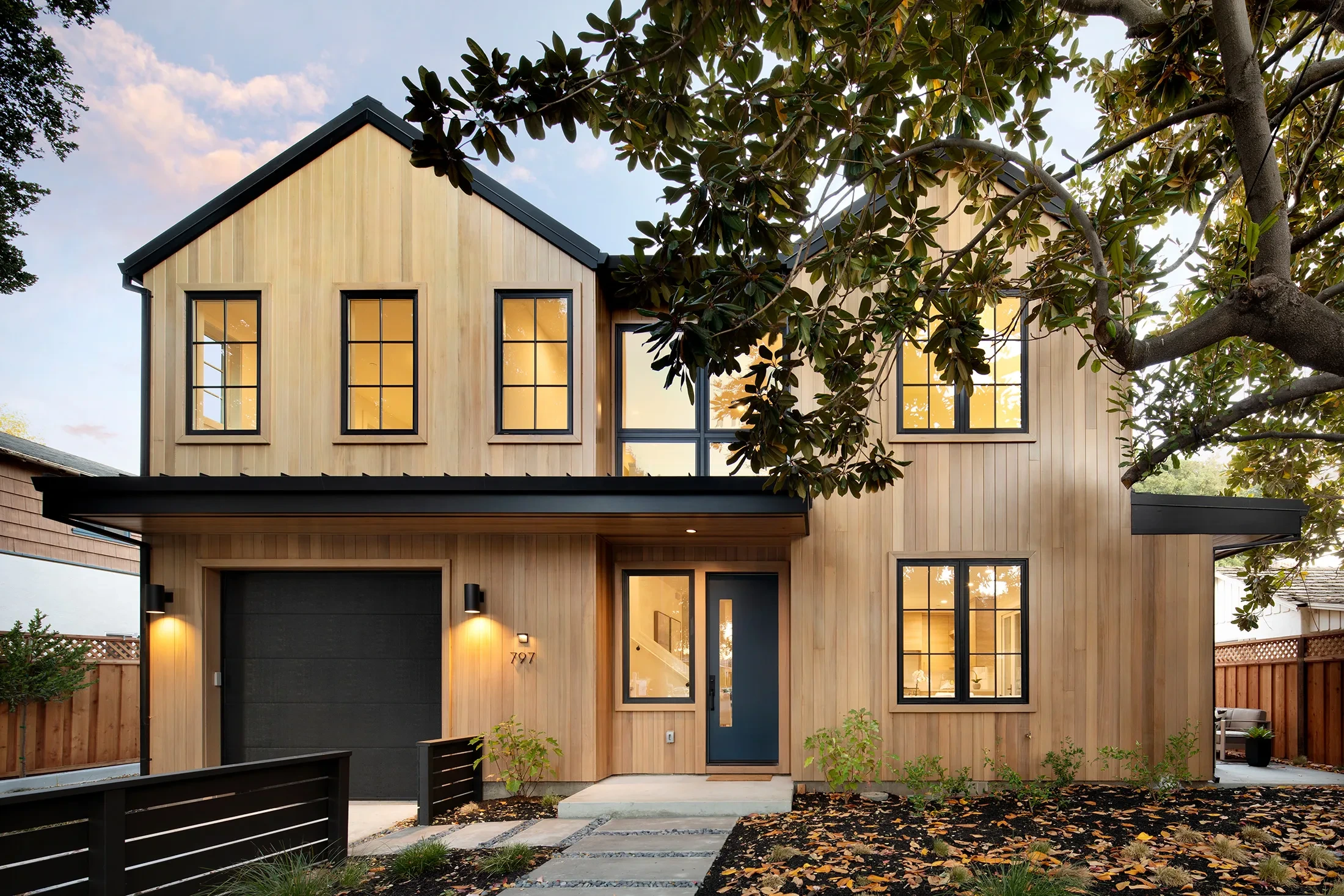 Live Oak by GHG Builders — barn-form front elevation at dusk