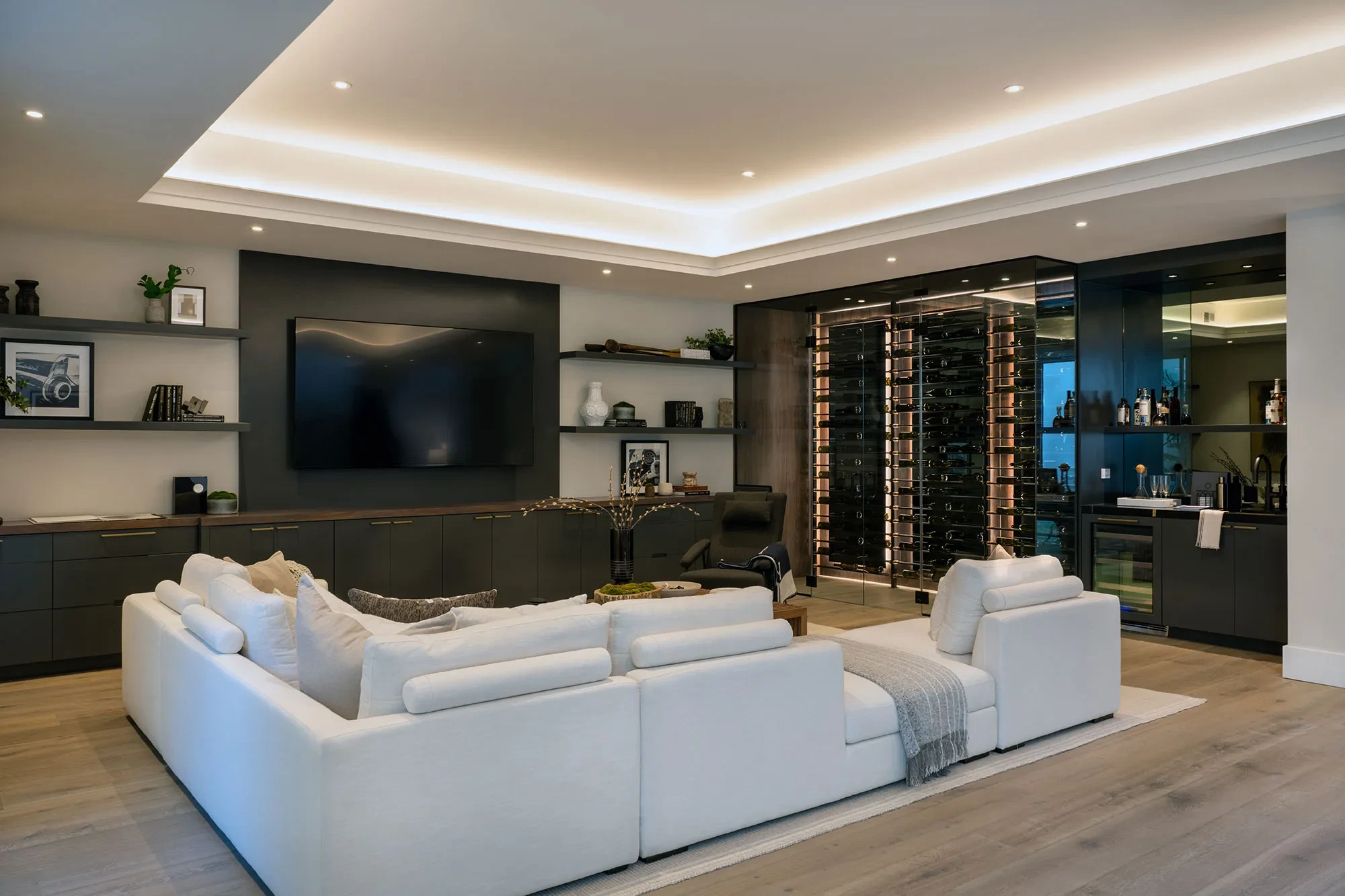 Shearer by GHG Builders — lower-level media lounge with wine display
