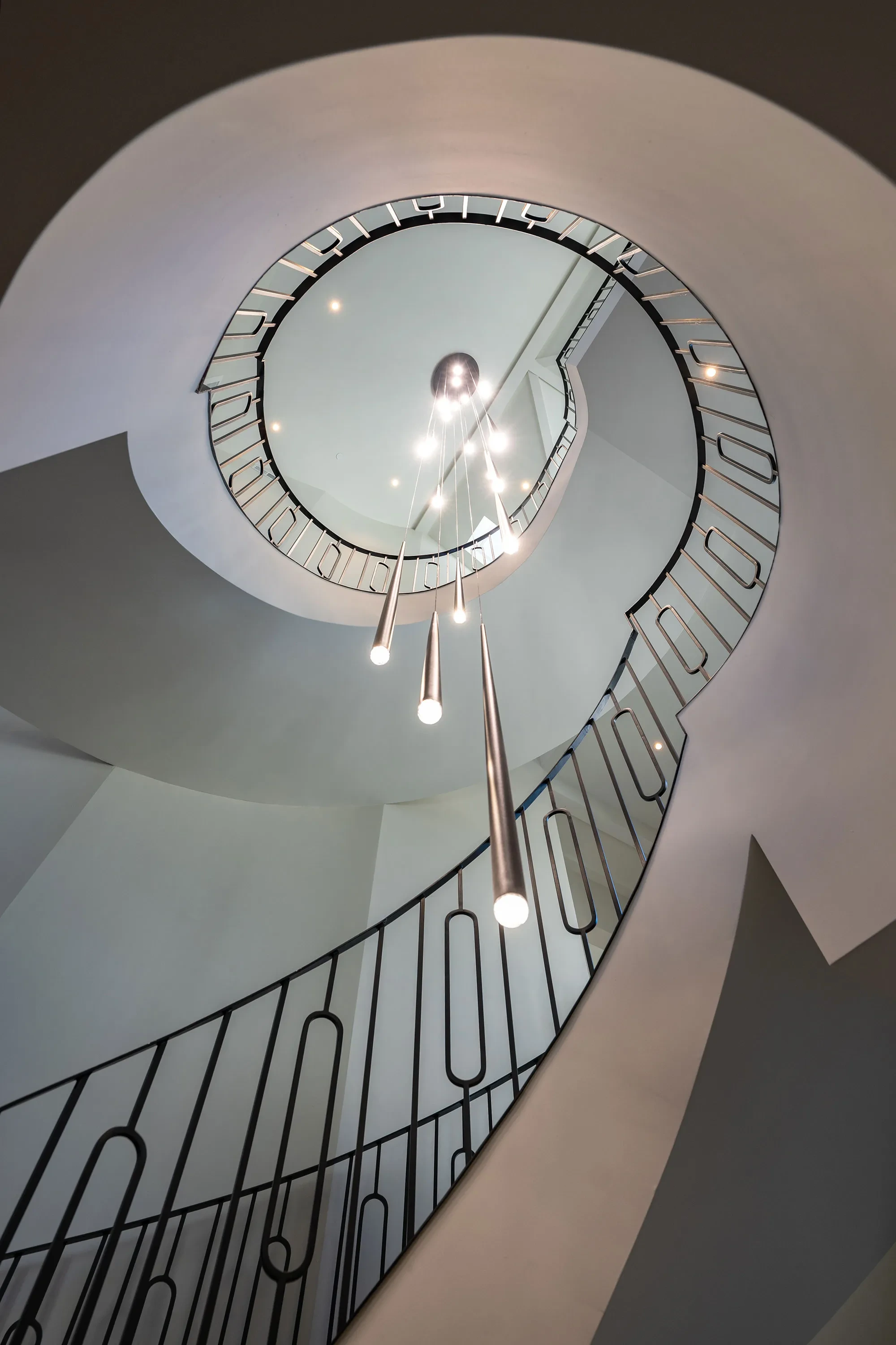 Shearer by GHG Builders — spiral staircase seen from above with pendant lighting