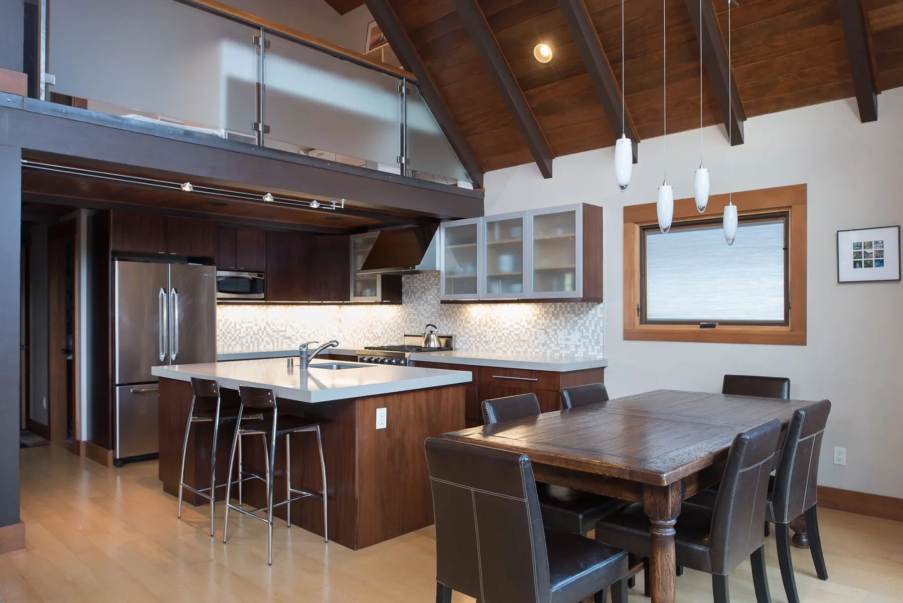 Tiger Tail by GHG Builders — kitchen and dining beneath a timber ceiling