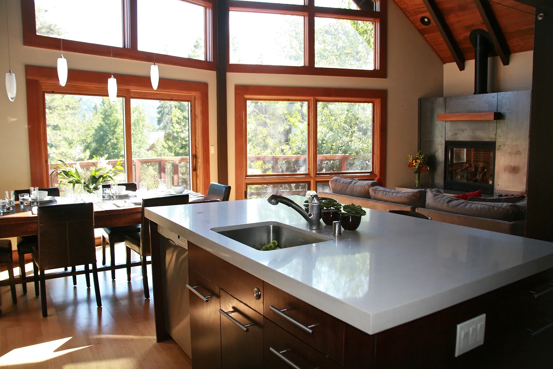 Tiger Tail by GHG Builders — kitchen island beneath exposed timber trusses