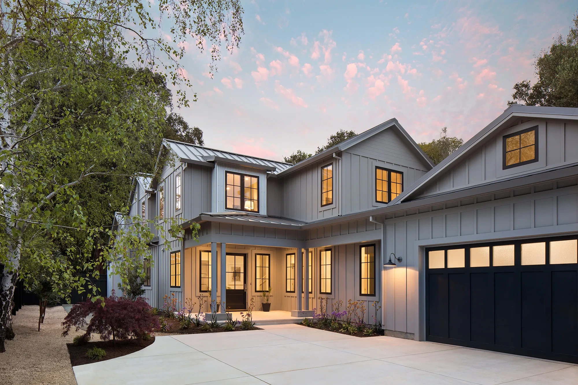 Valparaiso by GHG Builders — board-and-batten front elevation at dusk
