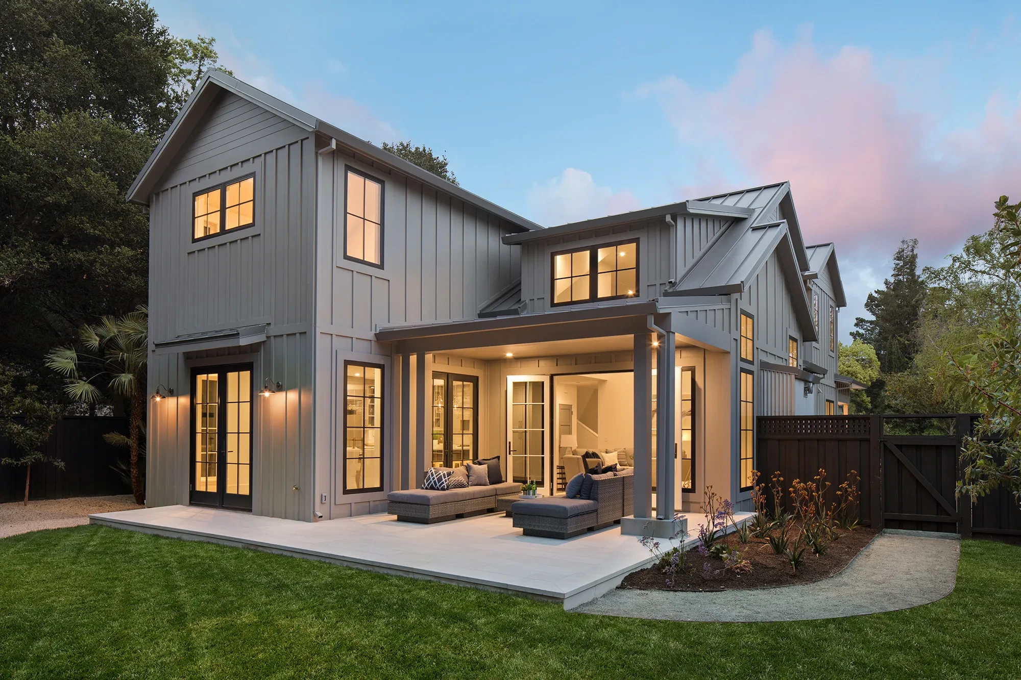 Valparaiso by GHG Builders — rear elevation and lawn at dusk